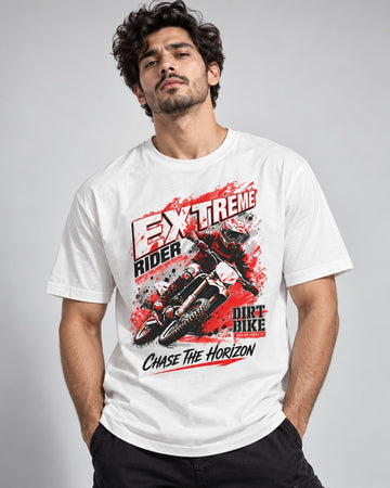 Close-up front view of a white Revanx t-shirt featuring a bold Extreme Rider motocross graphic print in red, black, and white.